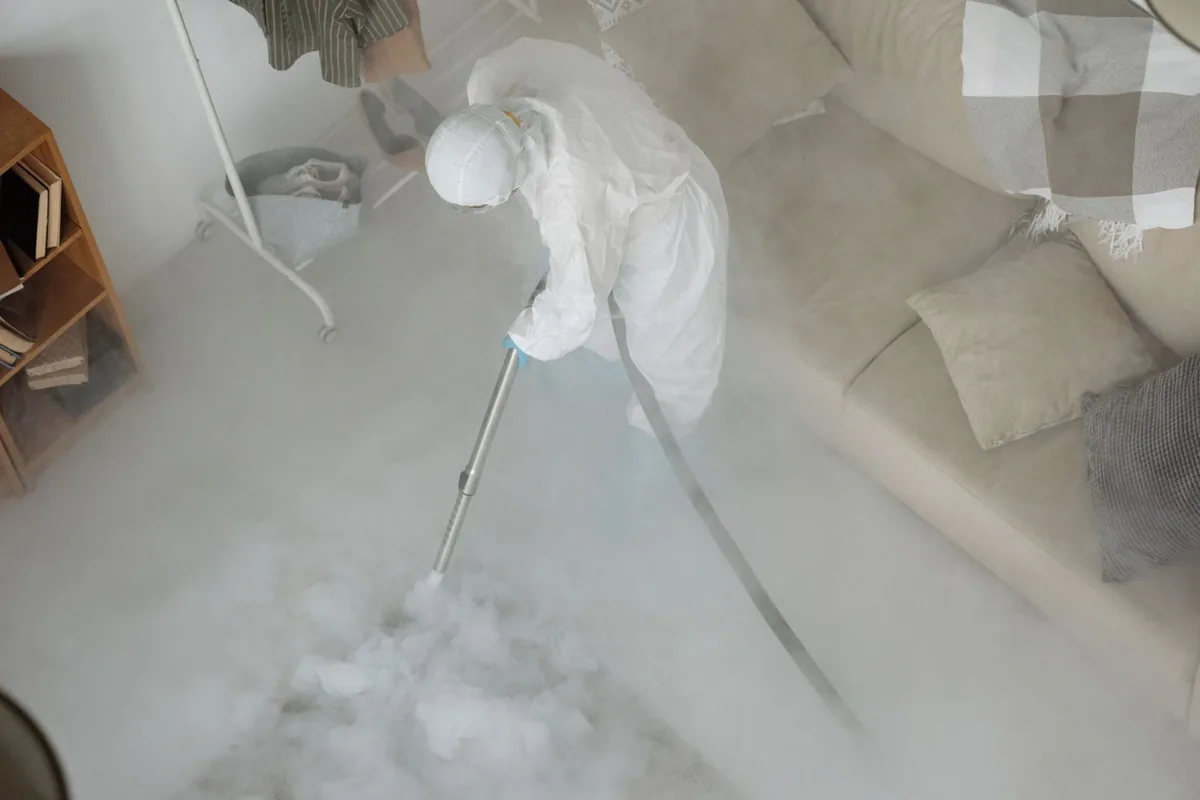 Biohazard cleanup technician in protective equipment, Hebbronville, TX